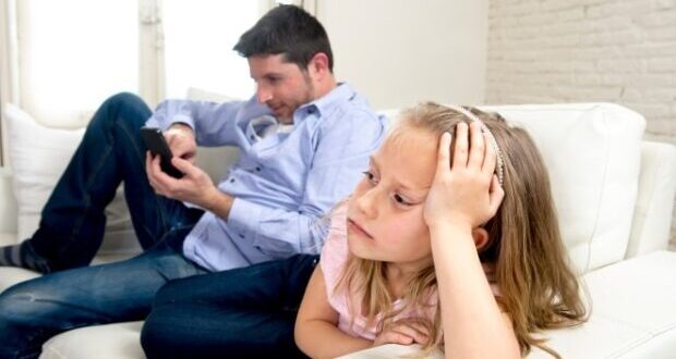 The disengaged stepfather- Dad using social media and ignoring his daughter