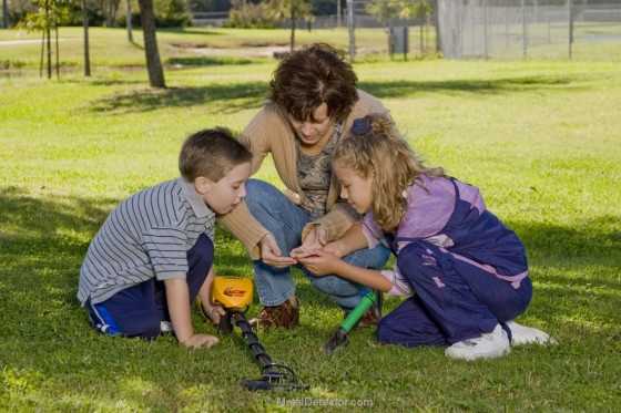 Metal Detectors - mom and kids using a metal detector