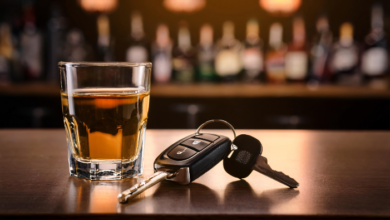 The dangers of drinking and driving - a glass of whiskey and a car key