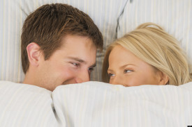 Sex - Close up of couple laughing in bed