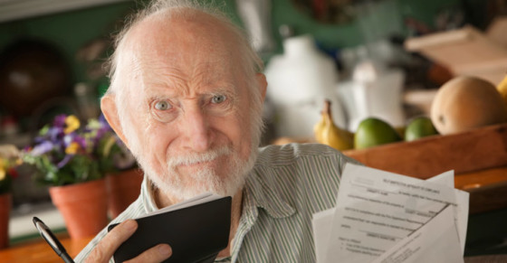 Aging parent - elderly-man-paying-bills