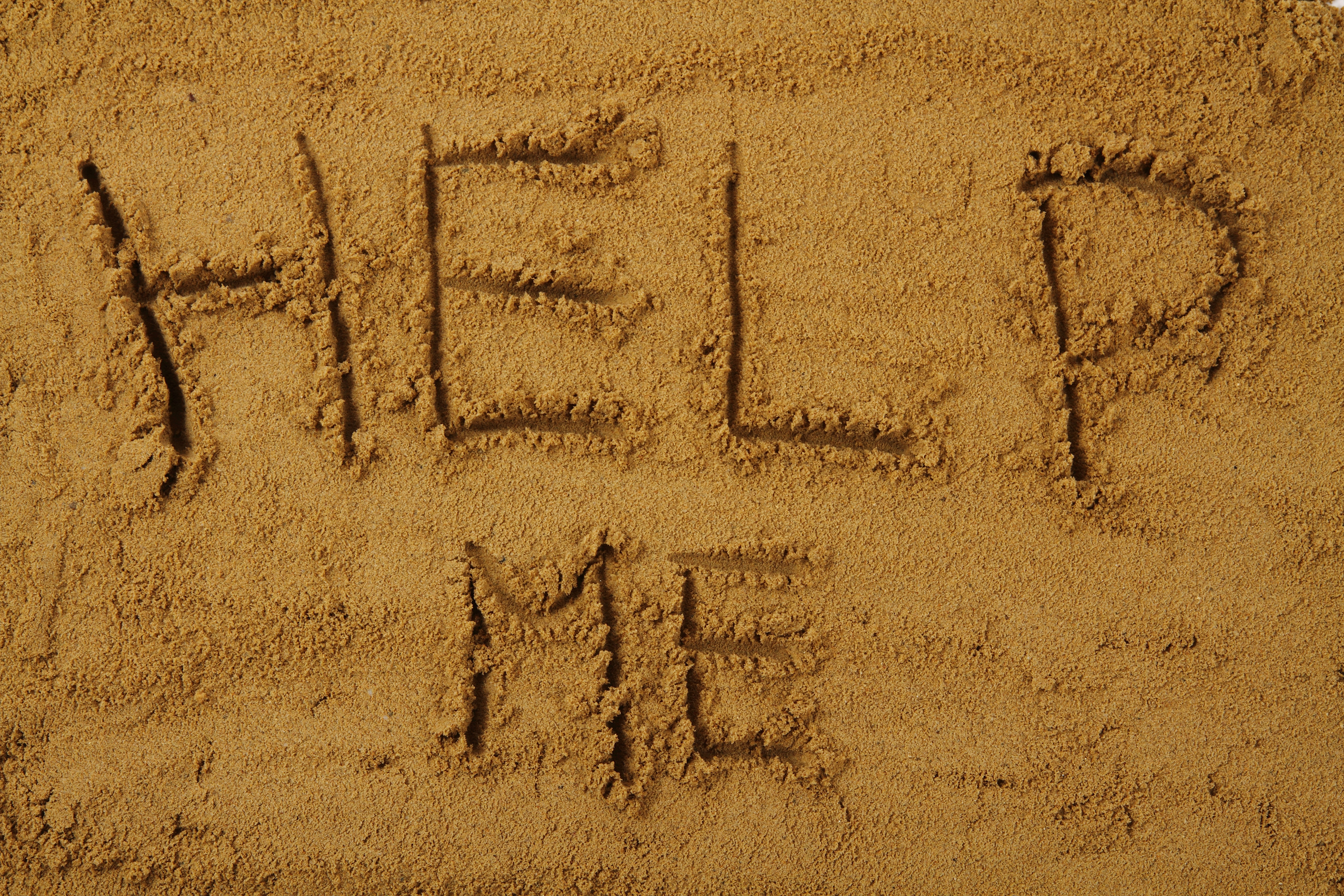 addressing the problem of teen suicide -help me in the sand as summer background