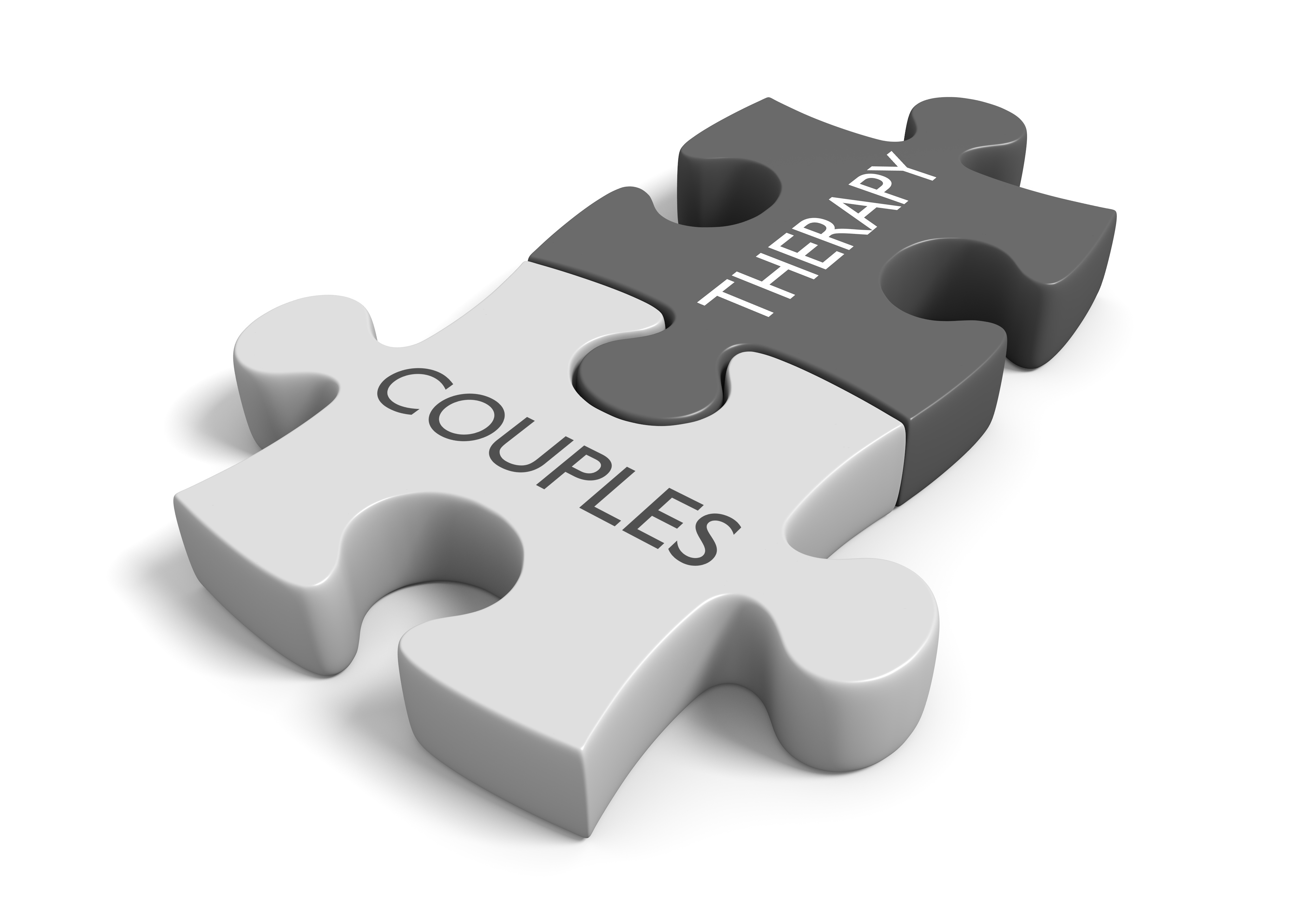 Two puzzle pieces with the words couples therapy