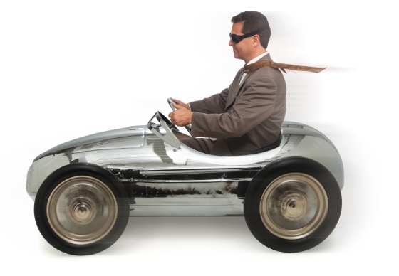 make your long commute feel shorter - man driving in toy car