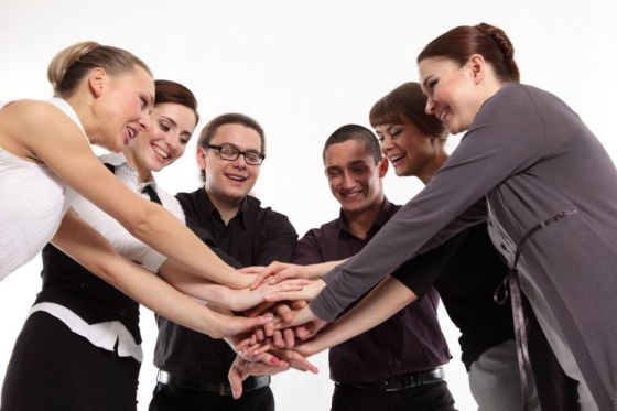 encouraging your kids to pursue a public relations career - young adults joining hands in a circle