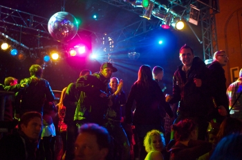 plan a surprise party for your partner - people celebrating, dancing and partying at a disco venue