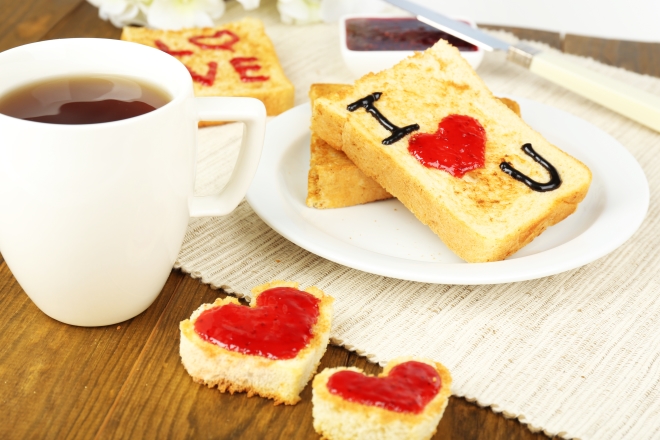 qualities every husband should have - Delicious toast with jam and cup of tea on table close-up