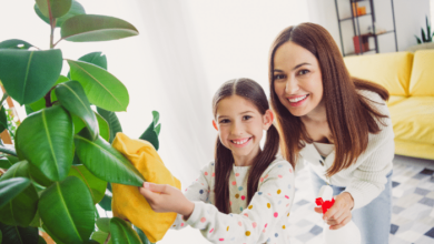 Spring cleaning tips for the entire family - mom and daughter cleaning a plant