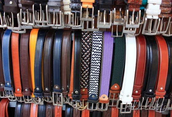 how to choose the right fashion belt - colored leather belts in store