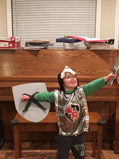 little adventures product review - Sarah's son modeling the knight vest, shield and sword