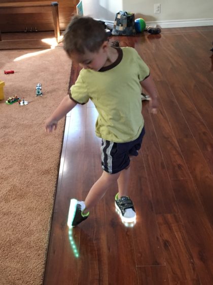 neon sneaker LED sneaker - Issac admiring his new sneakers