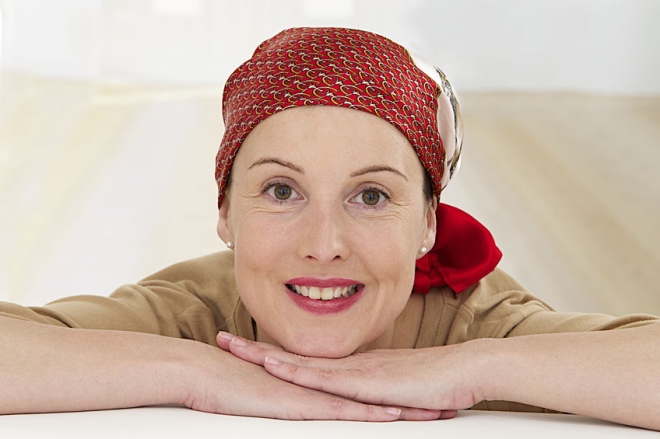 overcoming the stress and anxiety of cancer - a cheerful woman winning her battle with cancer