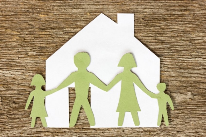 home boundaries to keep your children safe -Paper cutout of a house with family