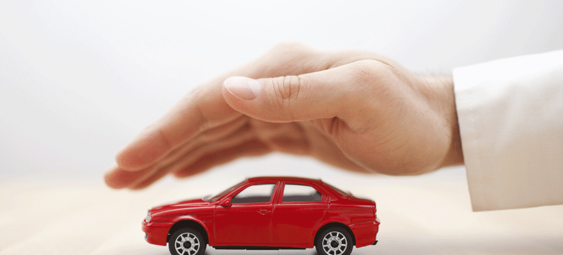safest used cars for your teen driver - picture of toy car protected by parent's hand