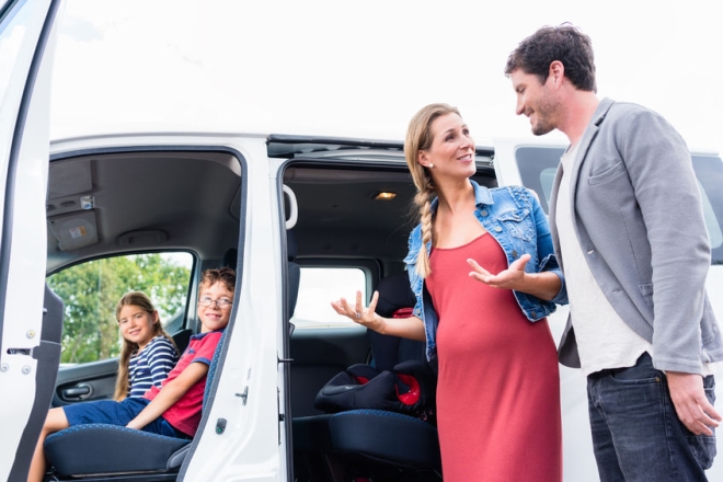 choose the best car for your family - blended family checking out a van