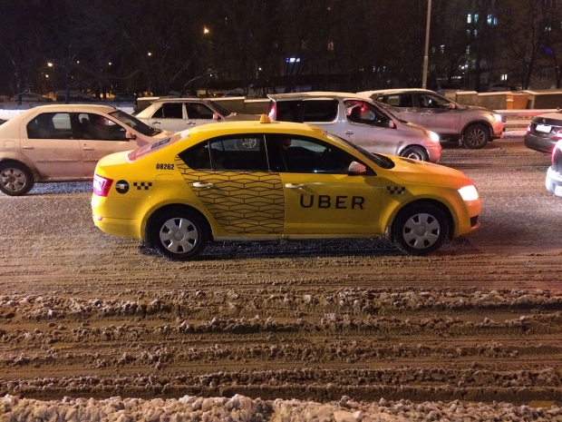 things all Uber drivers should know - picture of a yellow car with Uber on the passenger door