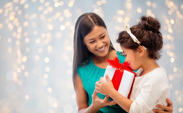 best gifts you can give a five-year-old - stepmother giving 5-year-old a gift