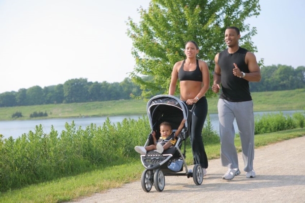 best baby jogging strollers - Young Couple Runing Outdoor with Little Boy in Stroller