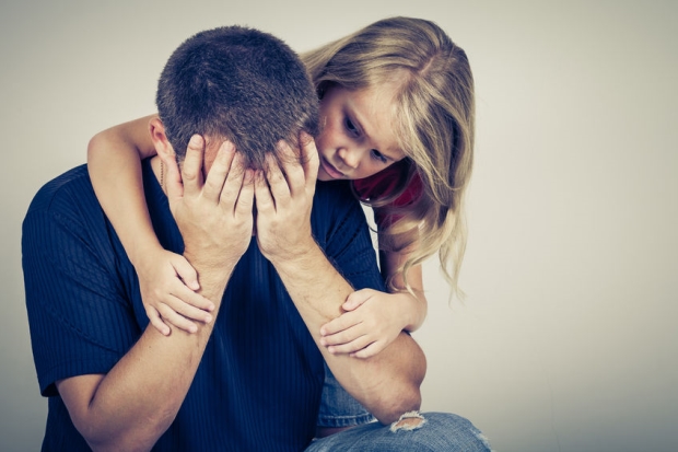 how kids will change your life - a daughter comforting her stepdad