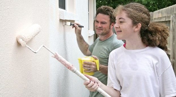 home family projects - stepdad and daughter painting the home exterior