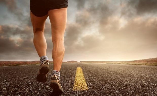 protect your knees while exercising - man running down the highway