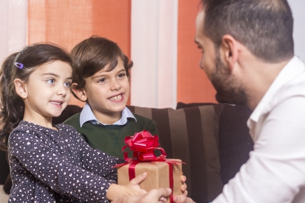 best gift ideas for dads - children presenting a gift to their stepdad