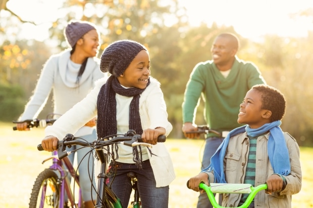 outdoor summer activities for the entire family - happy family riding bikes