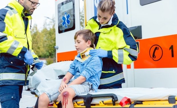 what to look for in kids after a car accident - child being treated after a car accident