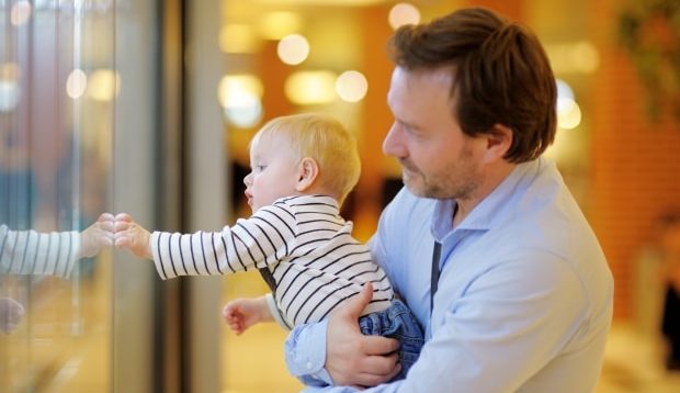 taking your stepchild on holiday -Father with baby son