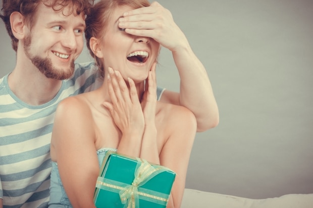 the best gifts for the special woman in your life - man giving woman a gift