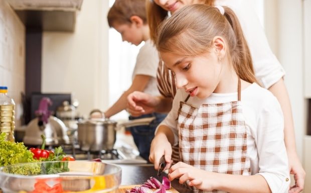 ways to make cooking dinner ten times easier -Mom and Kids making dinner in kitchen
