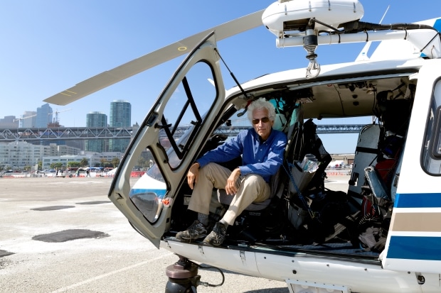 a helicopter ride - old man sitting in helicopter