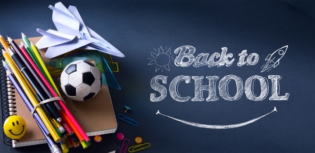 preparing your kids for back-to-school - chalk board with the words Back to School and school materials