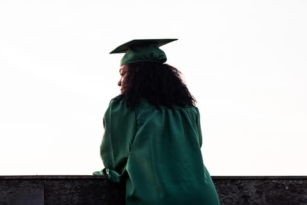 preparing your grad for their college experience -high school graduate comtemplating the future