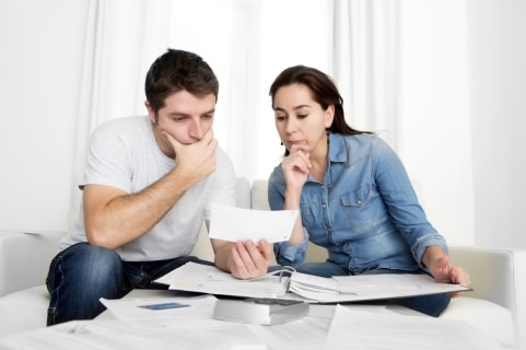 young couple worried about finances