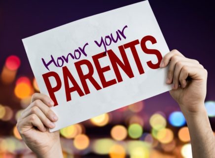 how to answer you're not my daddy -Honor Your Parents placard with night lights on background
