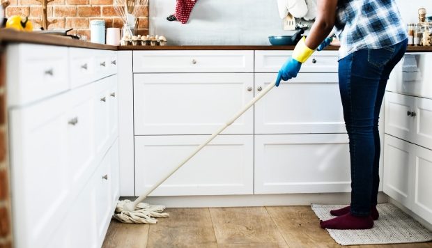 Tips for making your home a healthy place-woman mopping the floor