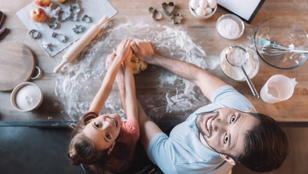 overhead view of single dad with daughter kneading dough