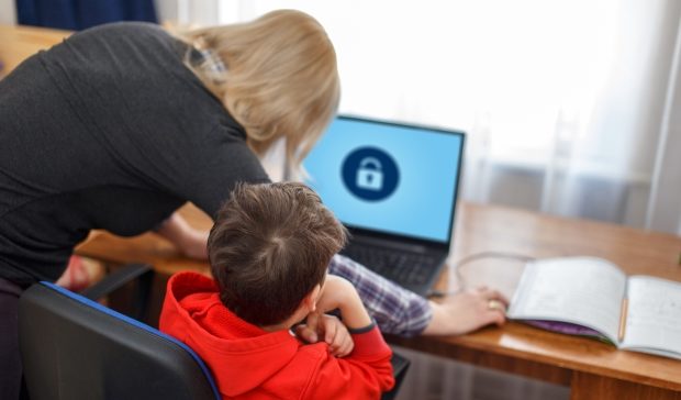 mom establishing parental controls on child's computer