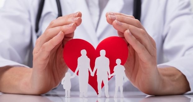 doctor protecting family cut out with heart shape