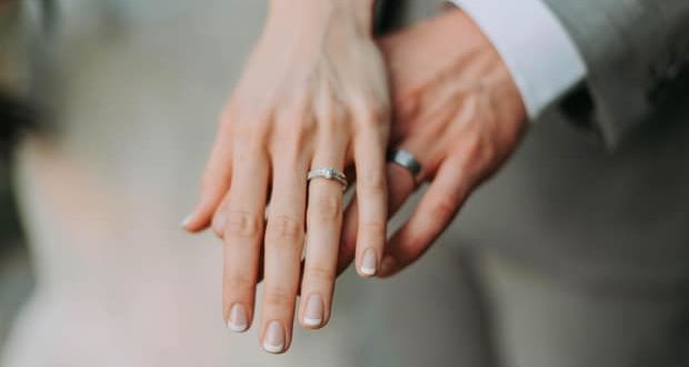 things possibly affecting your marriage-a couple showing their wedding bands