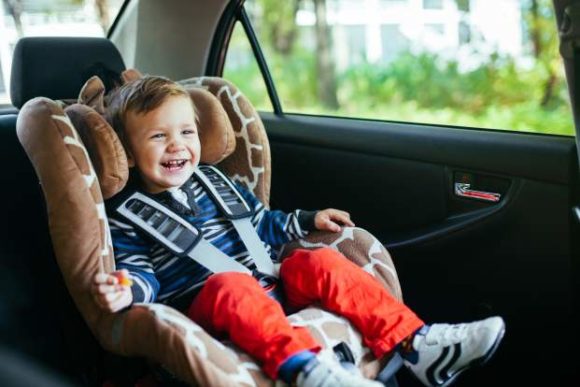 car seat safety guidelines-a happy child in a car seat