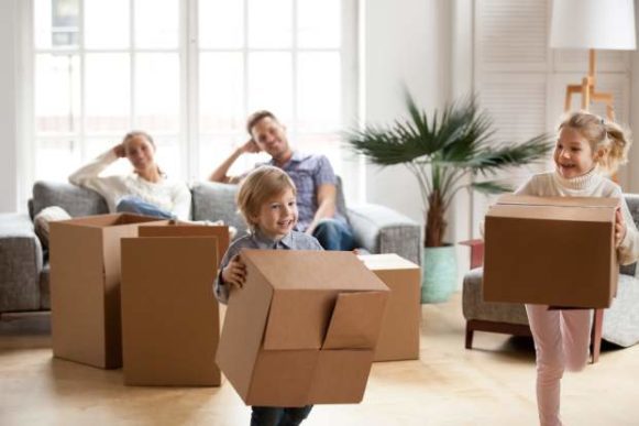 ways to help your kids adjust to a new city-family unpacking