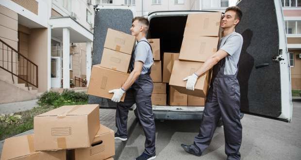 tips for hiring a moving company-workers offloading boxes from a moving van