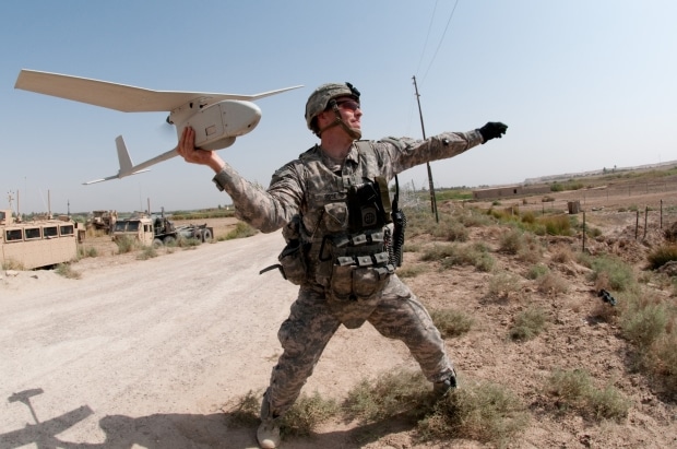 a drone story - soldier prepares to launch a drone