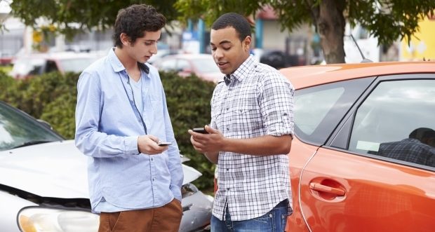 how to handle a car accident - Teenage Driver Making Phone Call After Traffic Accident