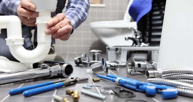 signs you need the services of a plumber-a plumber working