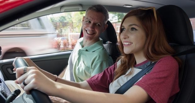 teaching your teen how to drive-a dad teaching his teen daughter how to drive