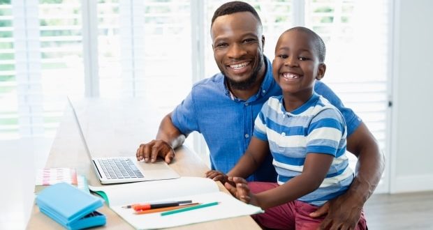 time management and improving grades-a dad helping his son with homework