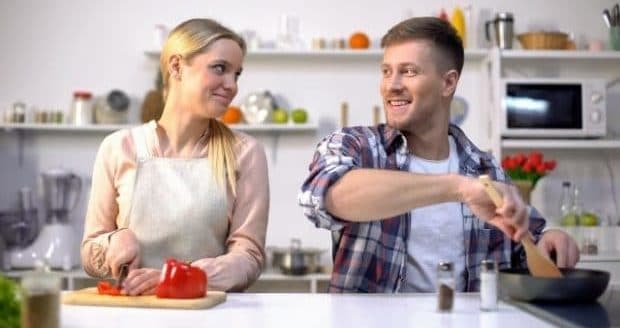 things to know about dating a divorced woman-a couple in the kitchen cooking